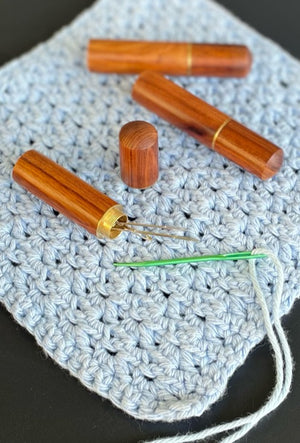 A polished timber darning wool needle case. With screw on lid. Perfect for all knitting, sewing, quilting and crochet projects. Includes 4 needles of various size.