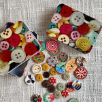 A tin to store buttons, pins, darning and embroidery needles.
