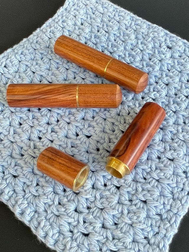 A polished timber darning wool needle case.  With screw on lid.  Perfect for all knitting, sewing, quilting and crochet projects.
