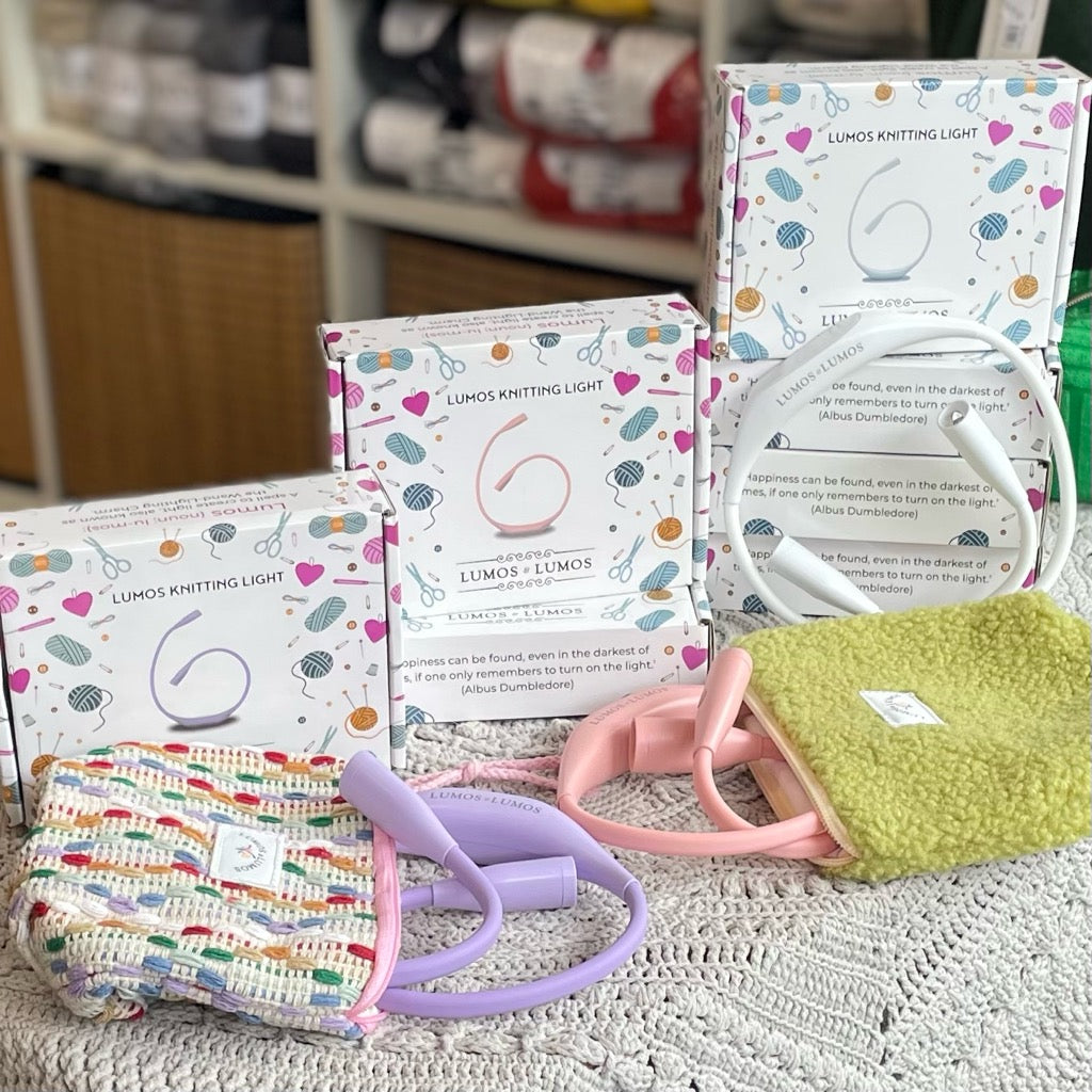Lumos light in colours white, pink & lavender with rainbow & pistachio pouches.  The best light for knitting and crocheting.