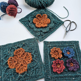 Three crocheted Shelley Husband squares with flower patterns, part of the Granny Square Garden workshop tour