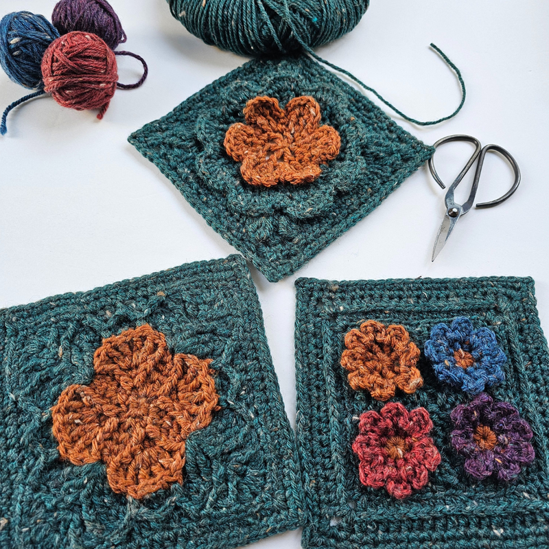 Three crocheted Shelley Husband squares with flower patterns, part of the Granny Square Garden workshop tour